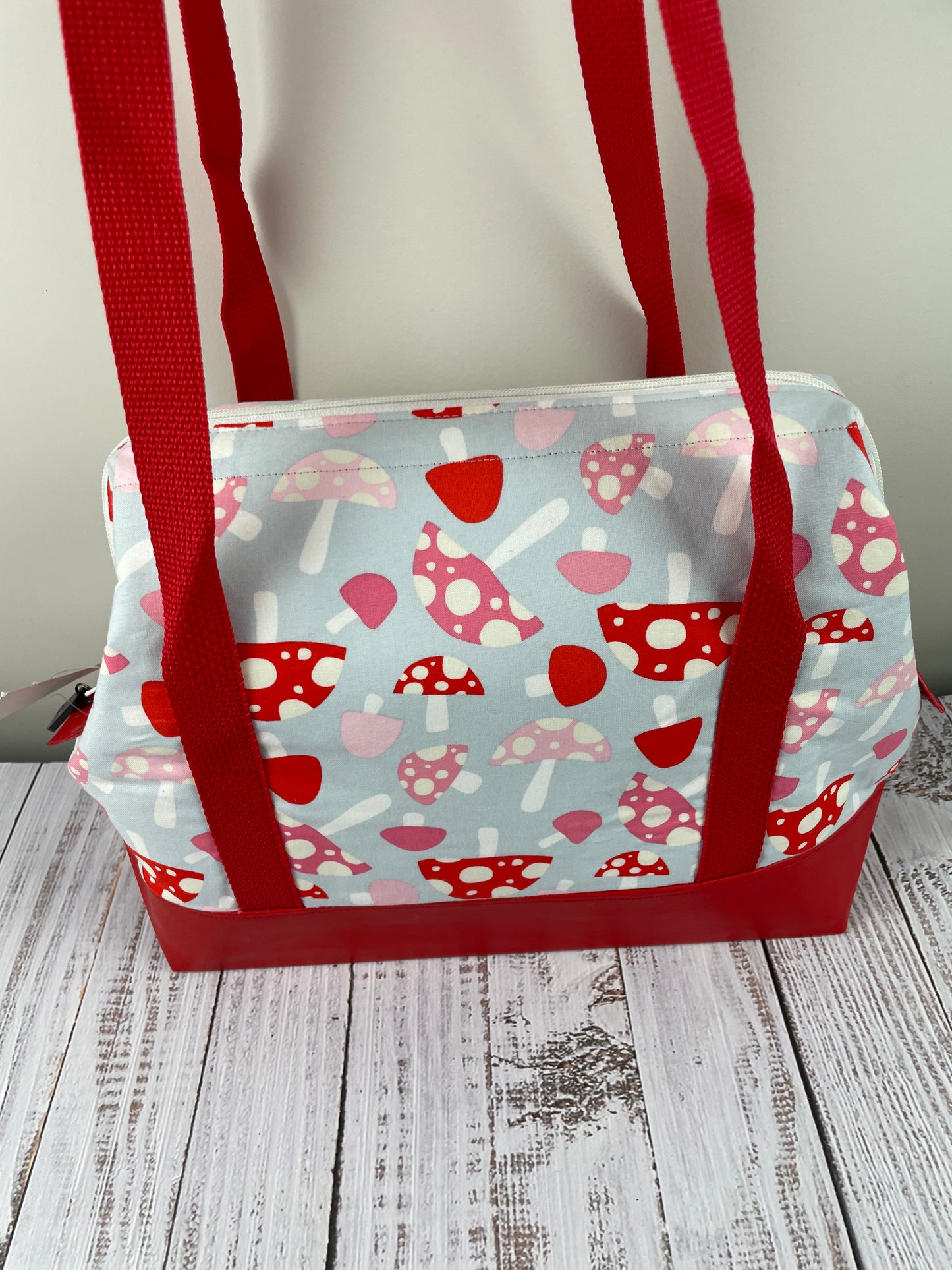 TOADSTOOLS ... large wire Frame bag featuring a red  faux leather  bottom