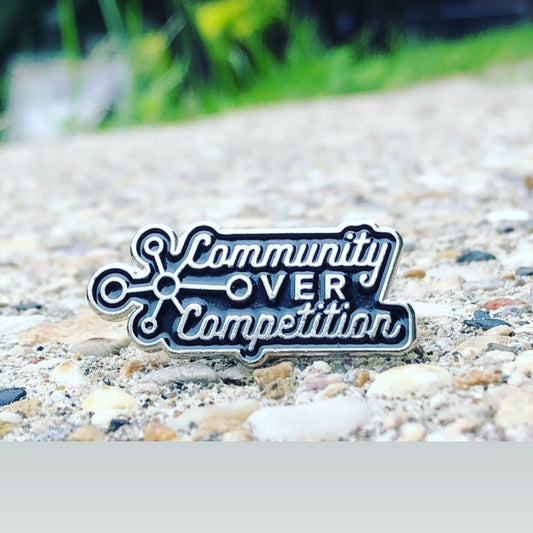 Community Over Competition Enamel pin